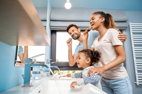 Mixed race family brushing teeth-1193399869