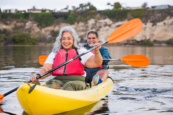 Older latinx couple boating